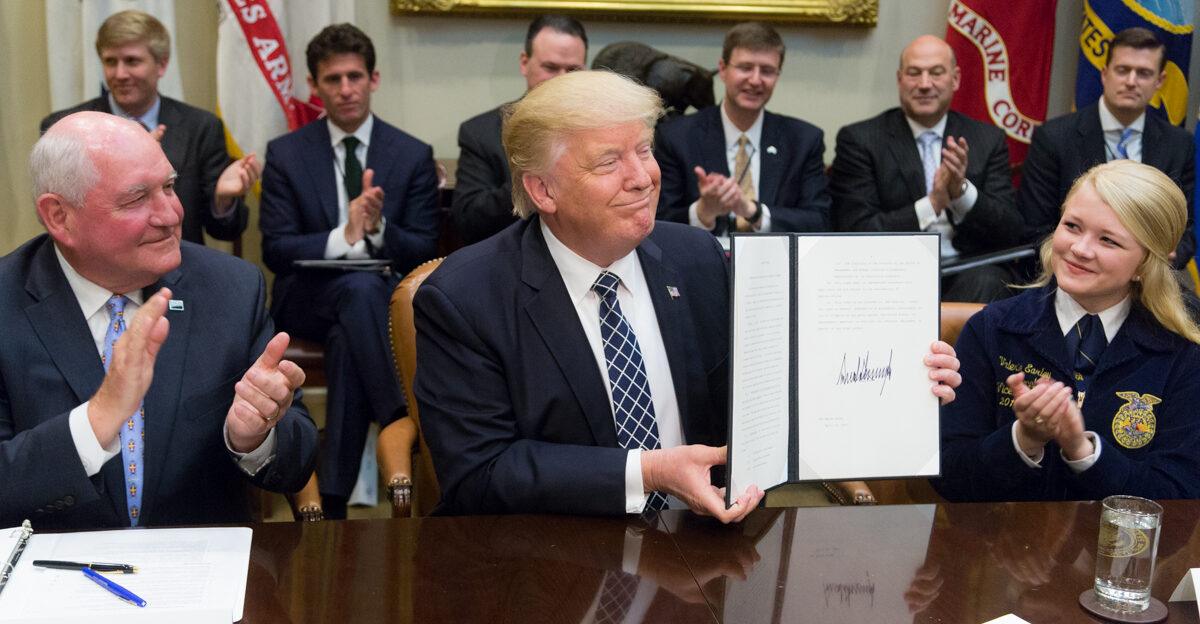President Donald Trump displays the signed Executive Order promoting Agriculture and Rural Prosperity in America during a roundtable with farmers and agricultural commissioners in the Roosevelt Room of the White House in Washington D C Tuesday April 25 2017