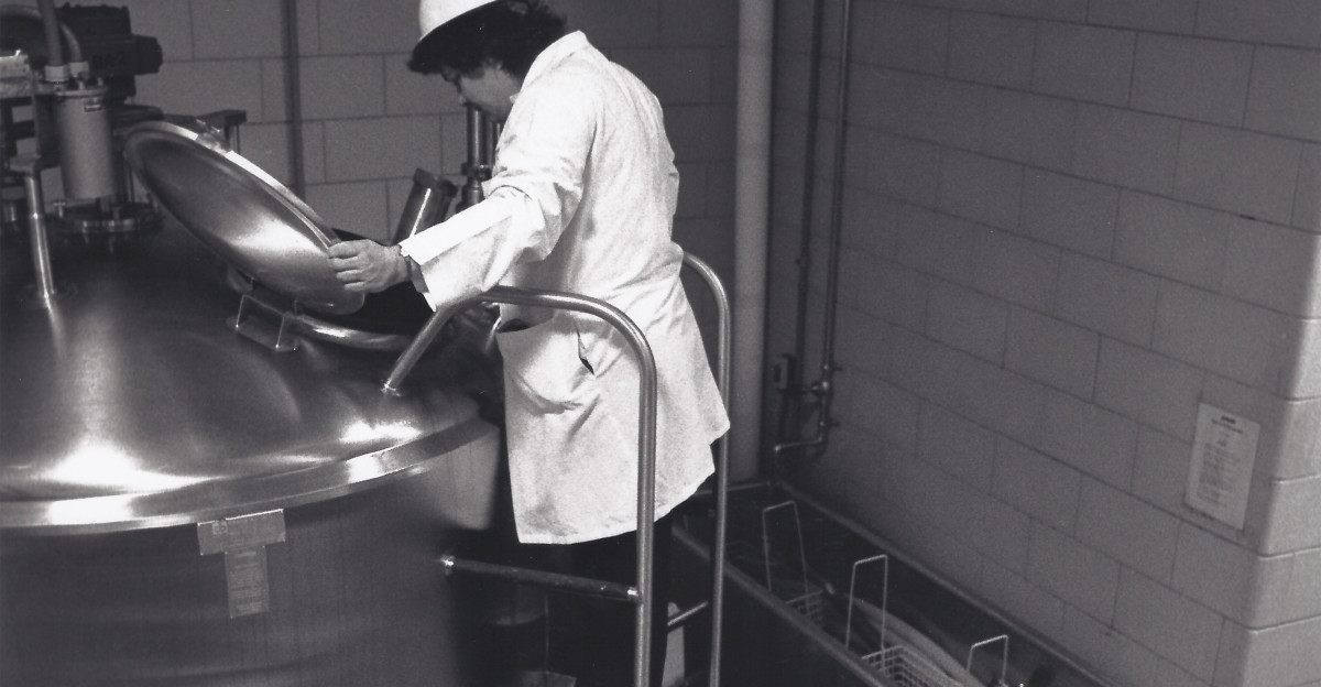 FDA investigator Rose Bucey is shown in this 1988 photo examining the blending tanks of a large ice cream plant Looking for bacteria she focuses on listeria monocytogenes in the midst of a series of disease outbreaks throughout the 1980s linked with the bacteria For more information about FDA history visit
