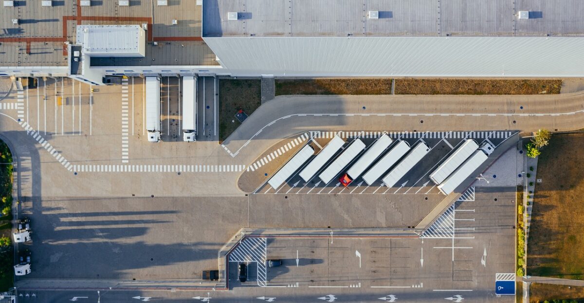 production facility logistic distribution center transit truck transport top view industrial semi aerial view heavy depot germany warehouse container truck shipping containers storehouse road loading bay factory unloading distribute unload europe aerial photography production logistic truck truck warehouse warehouse warehouse warehouse warehouse