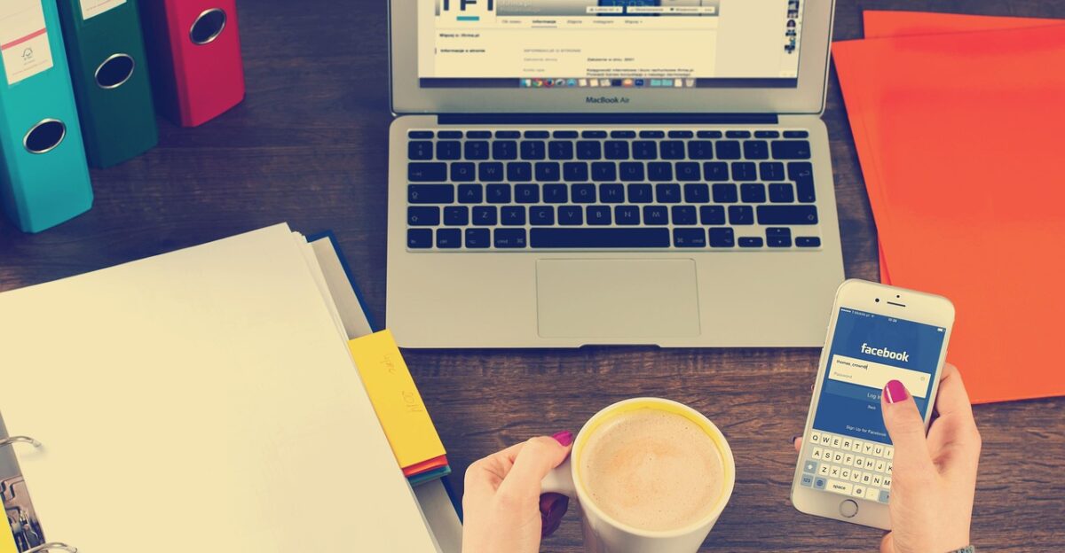 laptop iphone workspace hands coffee binders facebook social media social networking working notebook desk work office business macbook connection networking technology wireless facebook facebook social media social media social media social media social media