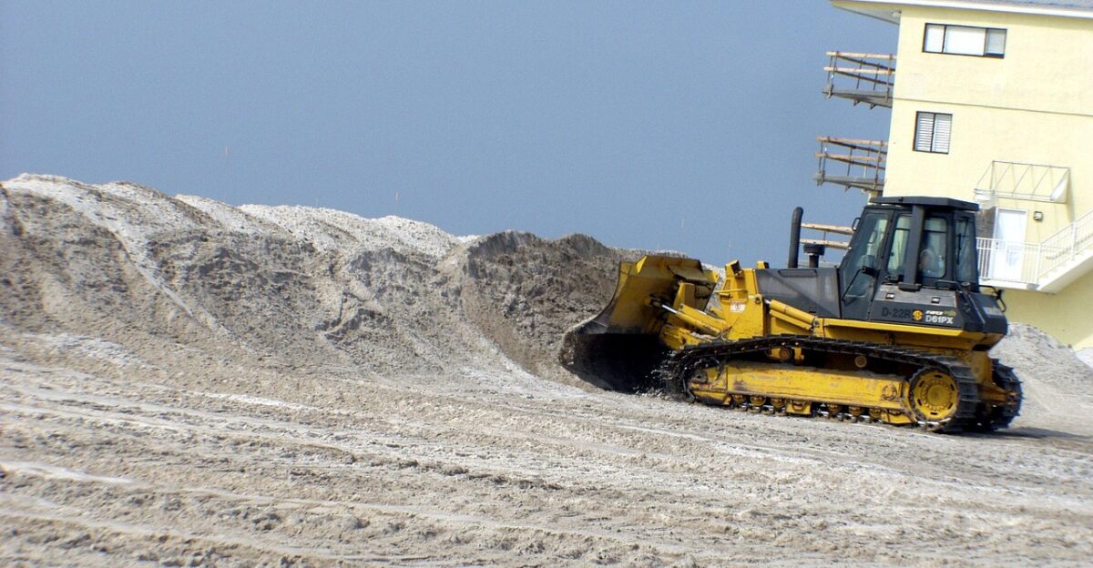pensacola beach florida bulldozer beach sand sky clouds hurricane cleanup nature outside sea ocean