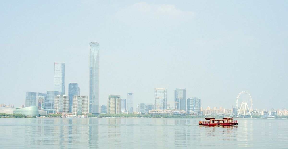 china asia suzhou to travel city building nature urban architecture panorama facade skyline skyscraper horizon property modern cityscape vacations water flow sea tourism trip boat ship lake