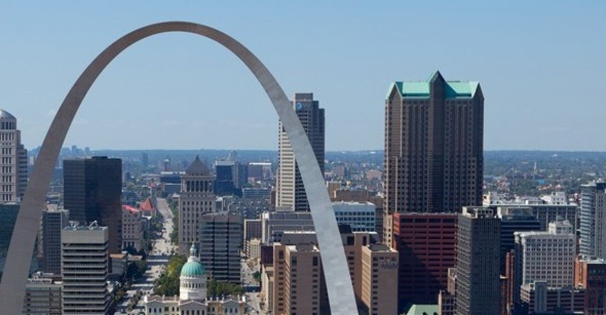 The Gateway Arch is a 630-foot 192 m monument in St Louis in the U S state of Missouri Clad in stainless steel and built in the form of an inverted weighted catenary arch it is the world s tallest arch the tallest monument in the Western Hemisphere and Missouri s tallest accessible building Built as a monument to the westward expansion of the United States it is the centerpiece of the Jefferson National Expansion Memorial and has become an internationally famous symbol of St Louis The arch sits at the site of St Louis founding on the west bank of the Mississippi River The Gateway Arch was designed by Finnish-American architect Eero Saarinen and German-American structural engineer Hannskarl Bandel in 1947 Construction began on February 12 1963 and was completed on October 28 1965 for 13 million equivalent to 180 million in 2013 The monument opened to the public on June 10 1967 Physical characteristics Both the width and height of the arch are 630 feet 192 m The arch is the tallest memorial in the United States and the tallest stainless steel monument in the world The cross-sections of the arch s legs are equilateral triangles narrowing from 54 feet 16 m per side at the bases to 17 feet 5 2 m per side at the top Each wall consists of a stainless steel skin covering a sandwich of two carbon-steel walls with reinforced concrete in the middle from ground level to 300 feet 91 m with carbon steel to the peak The arch is hollow to accommodate an unique tram system that takes visitors to an observation deck at the top The structural load is supported by a stressed-skin design Each leg is embedded in 25 980 short tons 23 570 t of concrete 44 feet 13 m thick and 60 feet 18 m deep Twenty feet 6 1 m of the foundation is in bedrock The arch is resistant to earthquakes and is designed to sway up to 9 inches 23 cm in either direction while withstanding winds up to 150 miles per hour 240 km h The structure weighs 42 878 short tons 38 898 t of which concrete composes 25 980 short tons 23 570 t structural steel interior 2 157 short tons 1 957 t and the stainless steel panels that cover the exterior of the arch 886 short tons 804 t This amount of stainless steel is the most used in any one project in history The base of each leg at ground level had to have an engineering tolerance of 1 64 inch 0 40 mm or the two legs would not meet at the top Design competition 1945-1948 In November 1944 Smith discussed with Newton Drury the National Park Service Director the design of the memorial asserting that the memorial should be transcending in spiritual and aesthetic values best represented by one central feature a single shaft a building an arch or something else that would symbolize American culture and civilization The idea of an architectural competition to determine the design of the memorial was favored at the inaugural meeting of the Jefferson National Expansion Memorial Association JNEMA which planned to award cash for the best design In January 1945 the JNEMA officially announced a two-stage design competition that would cost 225 000 to organize Smith and the JNEMA struggled to raise the funds garnering only a third of the required total by June 1945 Then mayor Aloys Kaufmann feared that the lack of public support would lead officials to abandon hope in the project The passage of a year brought little success and Smith frantically underwrote the remaining 40 000 in May 1946 By June Smith found others to assume portions of his underwriting with 17 000 remaining under his sponsorship In February 1947 the underwriters were compensated and the fund stood over 231 199 Saarinen s team included himself as designer J Henderson Barr as associate designer and Dan Kiley as landscape architect as well as Lily Swann Saarinen as sculptor and Alexander Girard as painter In the first stage of the competition Swedish sculptor Carl Milles advised Saarinen to change the bases of each leg to triangles instead of squares Saarinen said that he worked at first with mathematical shapes but finally adjusted it according to the eye At submission Saarinen s plans laid out the arch at 509 feet 155 m tall and 592 feet 180 m wide from center to center of the triangle bases On September 1 1947 submissions for the first stage were received by the jury The submissions were labeled by numbers only and the names of the designers were kept anonymous Upon four days of deliberation the jury narrowed down the 172 submissions which included Saarinen s father Eliel to five finalists and announced the corresponding numbers to the media on September 27 Saarinen s design 144 was among the finalists and comments written on it included relevant beautiful perhaps inspired would be the right word Roland Wank and an abstract form peculiarly happy in its symbolism Charles Nagel Hare questioned the feasibility of the design but appreciated the thoughtfulness behind it Local St Louis architect Harris Armstrong was also one of the finalists The secretary who sent out the telegrams informing finalists of their advancement mistakenly sent one to Eliel rather than Eero The family celebrated with champagne and two hours later a competition representative called to correct the mistake Eliel broke out a second bottle of champagne to toast his son Public access In April 1965 three million tourists were expected to visit the arch after completion 619 763 tourists visited the top of the arch in its first year open On January 15 1969 a visitor from Nashville Tennessee became the one-millionth person to reach the observation area the ten-millionth person ascended to the top on August 24 1979 In 1974 the arch was ranked fourth on a list of most-visited man-made attraction The Gateway Arch is one of the most visited tourist attractions in the world with over four million visitors annually of which around one million travel to the top The arch was listed as a National Historic Landmark on June 2 1987 and is also listed on the National Register of Historic Places Visitor center The underground visitor center for the arch was designed as part of the National Park Service s Mission 66 program The 70 000-square-foot 6 500 m2 center is located directly below the arch between its legs Although construction on the visitor center began at the same time as construction for the arch itself it did not conclude until 1976 because of insufficient funding however the center opened with several exhibits on June 10 1967 Access to the visitor center is provided through ramps adjacent to each leg of the arch Observation area Near the top of the Arch passengers exit the tram compartment and climb a slight grade to enter the observation area This arched deck 65 feet 20 m long and 7 feet 2 1 m wide can hold about 160 people four trams worth Sixteen windows per side each measuring 7 by 27 inches 180 mm 690 mm offer views up to 30 miles 48 km to the east across the Mississippi River and southern Illinois with its prominent Mississippian culture mounds at Cahokia Mounds and to the west over the city of St Louis and St Louis County beyond Symbolism and culture Built as a monument to the westward expansion of the United States the arch typifies the pioneer spirit of the men and women who won the West and those of a latter day to strive on other frontiers The arch has become the iconic image of St Louis appearing in many parts of city culture In 1968 three years after the monument s opening the St Louis phone directory contained 65 corporations with Gateway in their title and 17 with Arch Arches also appeared over gas stations and drive-in restaurants In the 1970s a local sports team adopted the name Fighting Arches St Louis Community College would later when consolidating all athletic programs under a single banner name its sports teams Archers Robert S Chandler an NPS superintendent said Most visitors are awed by the size and scale of the Arch but they don t understand what it s all about Too many people see it as just a symbol of the city of St Louis The arch has also appeared as a symbol of the State of Missouri On November 22 2002 at the Missouri State Capitol Lori Hauser Holden wife of then Governor Bob Holden uncovered the winning design for a Missouri coin design competition as part of the Fifty States Commemorative Coin Program Designed by watercolorist Paul Jackson the coin portrays three members of the Lewis and Clark expedition paddling a boat on the Missouri River upon returning to St Louis with the arch as the backdrop Holden said that the arch was a symbol for the entire state Four million visitors each year see the Arch The coin will help make it even more loved worldwide A special license plate designed by Arnold Worldwide featured the arch labeled with Gateway to the West Profits earned from selling the plates would fund the museum and other educational components of the arch