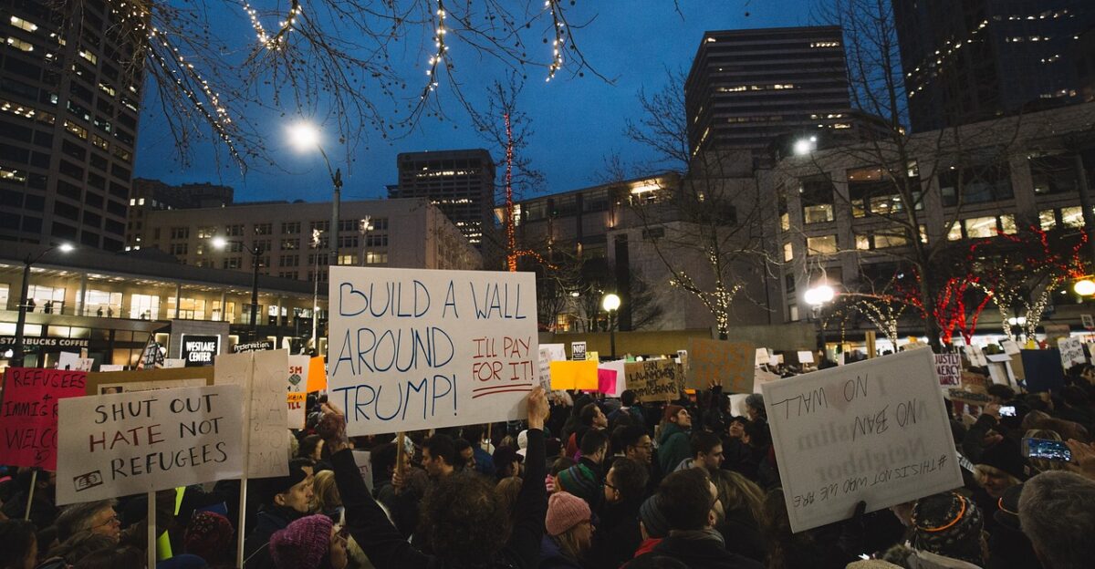 people man woman protest rally equality trump refugees empowerment unite dark night trump trump trump trump trump refugees