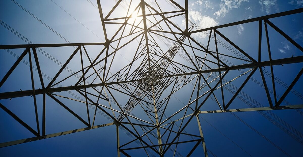 pylon electricity sun power grid infrastructure nature industrial landscape sky cloudscape perspective height scale