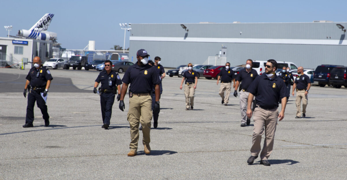 ICE Homeland Security Investigations HSI Special Agents inspect international cargo arriving in Los Angeles with PPE Personal Protective Equipment during Covid 19 outbreak