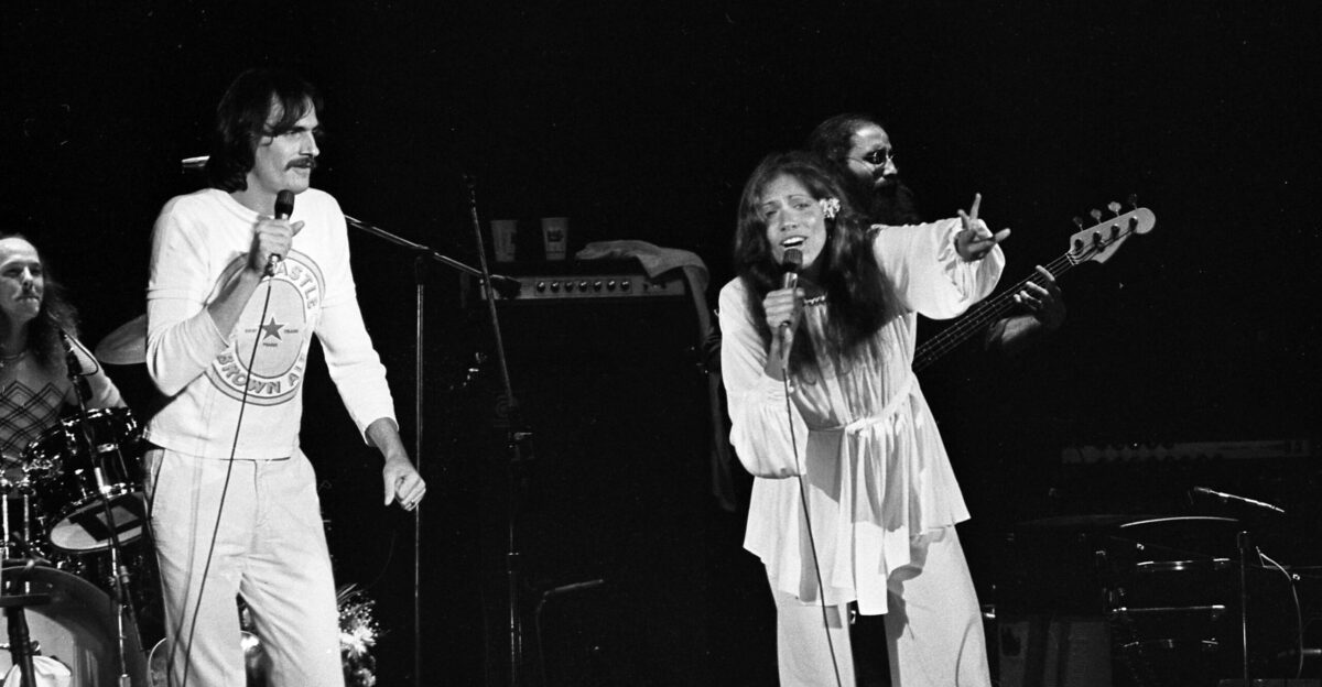 James Taylor and Carly Simon performing onstage in Los Angeles