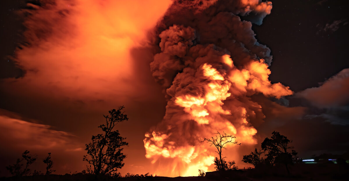 Spectacular plumes of gas and ash reflect the glow from lava in the summit crater of K lauea volcano NPS Photo J Wei