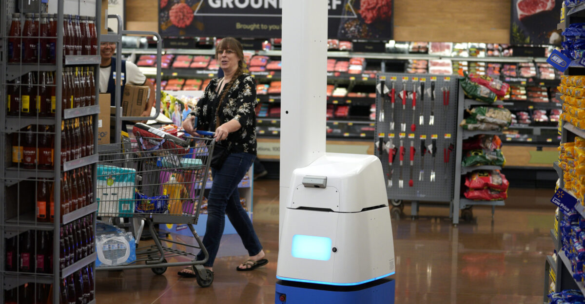 As Walmart turns to robots it s the human workers who feel like