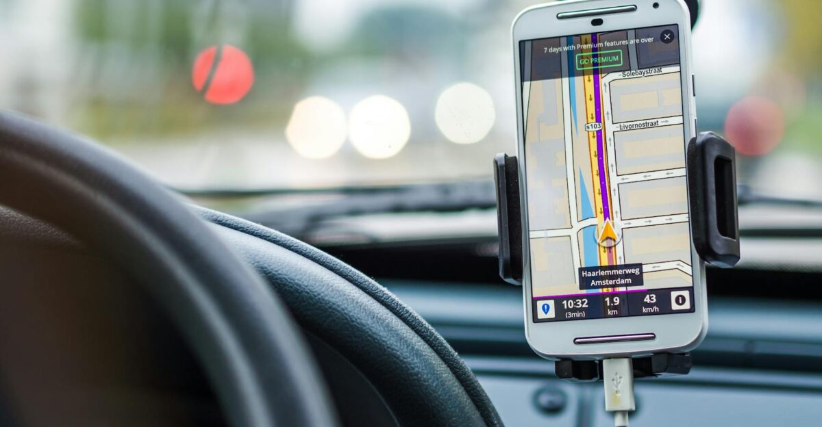 Smartphone mounted in car using GPS for navigation and directions