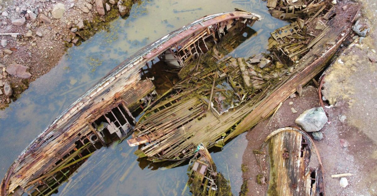 Aerial view of decaying wooden shipwrecks in Teriberka Murmansk Russia