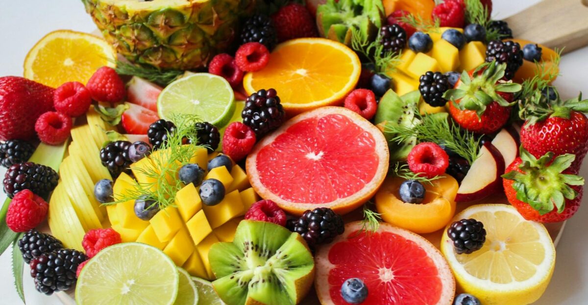 A vibrant assortment of fresh fruits beautifully arranged on a platter perfect for a healthy and delicious snack