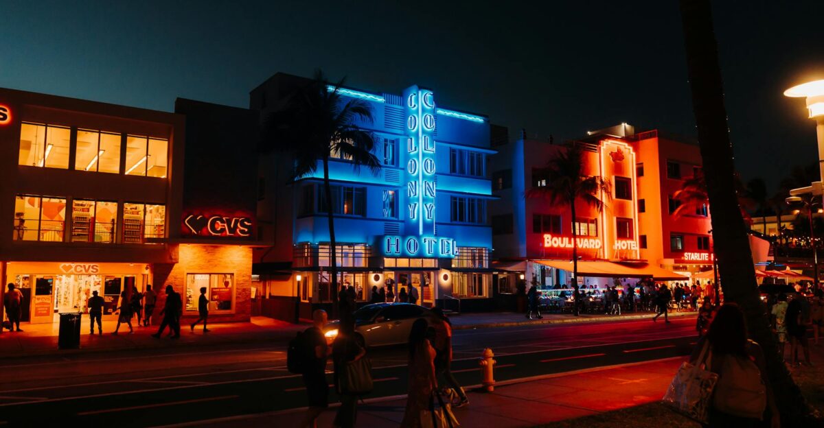 Colorful neon lights and lively street scene on Ocean Drive Miami Beach FL