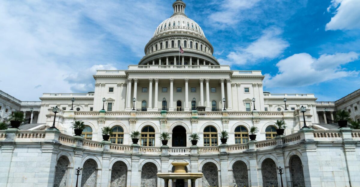 Exterior view of the iconic US Capitol Building on a sunny day in Washington DC