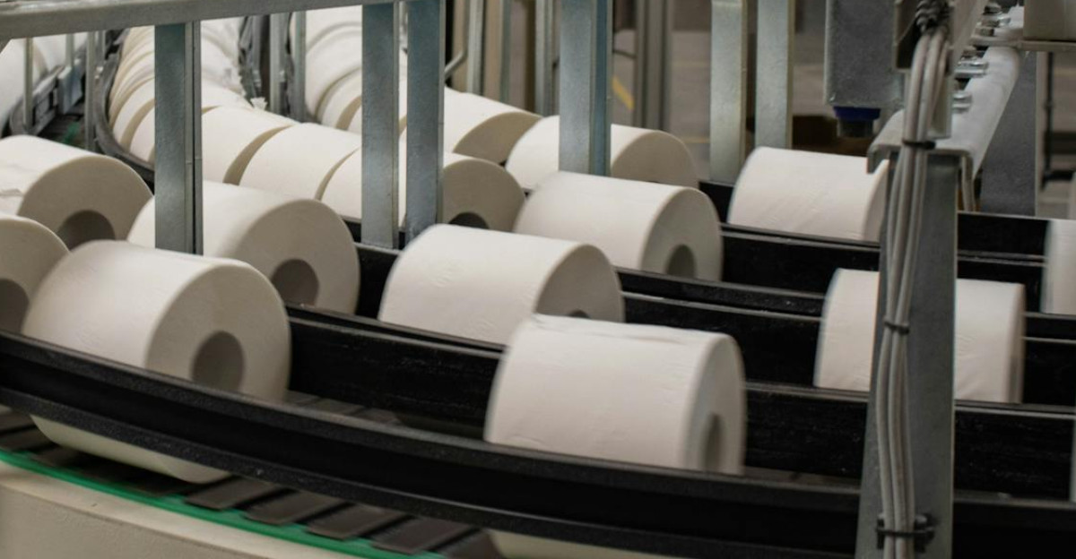Photographer captures a production line for toilet paper in an industrial setting