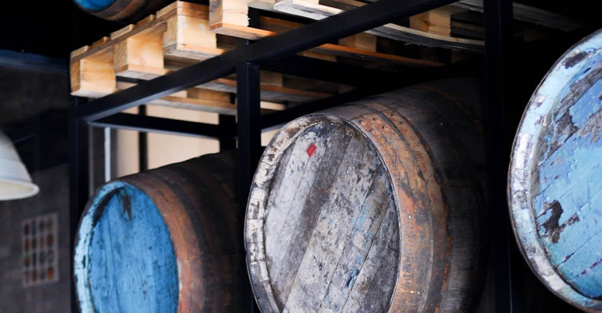 Stack of wooden barrels in an industrial-style pub interior ideal for themes of aging and tradition