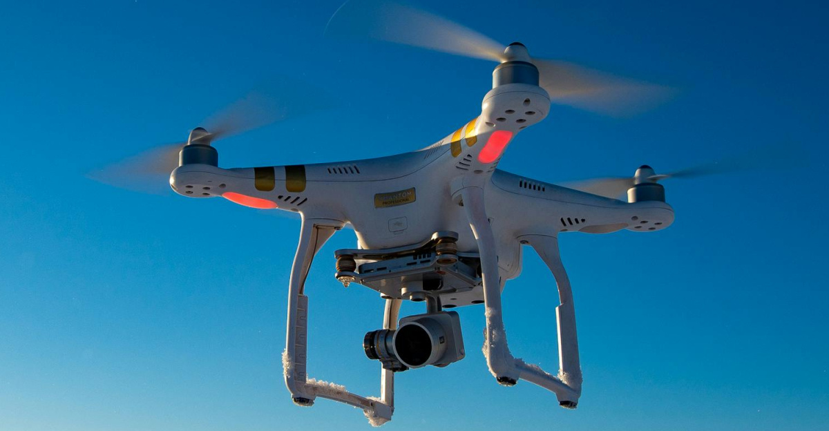 Aerial shot of a drone flying above a snow-covered field during winter in Tierra del Fuego.