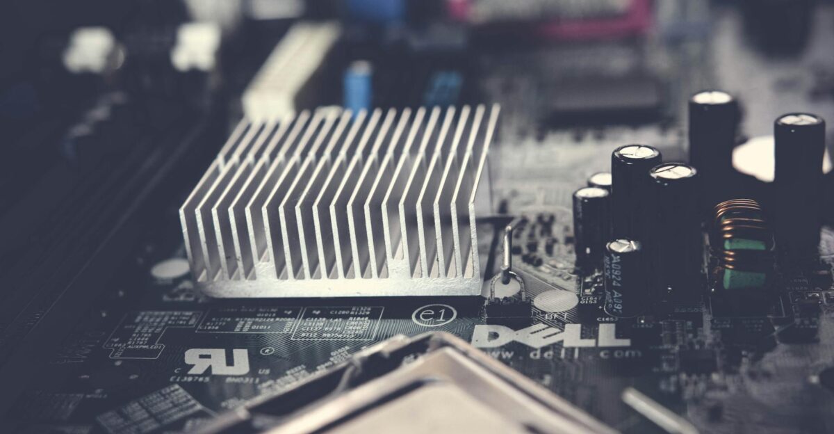 Detailed view of a computer motherboard featuring a heatsink and electronic components showcasing modern technology