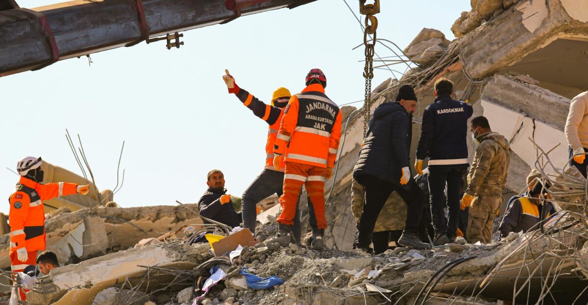 Rescue workers searching through rubble after an earthquake showcasing teamwork and determination