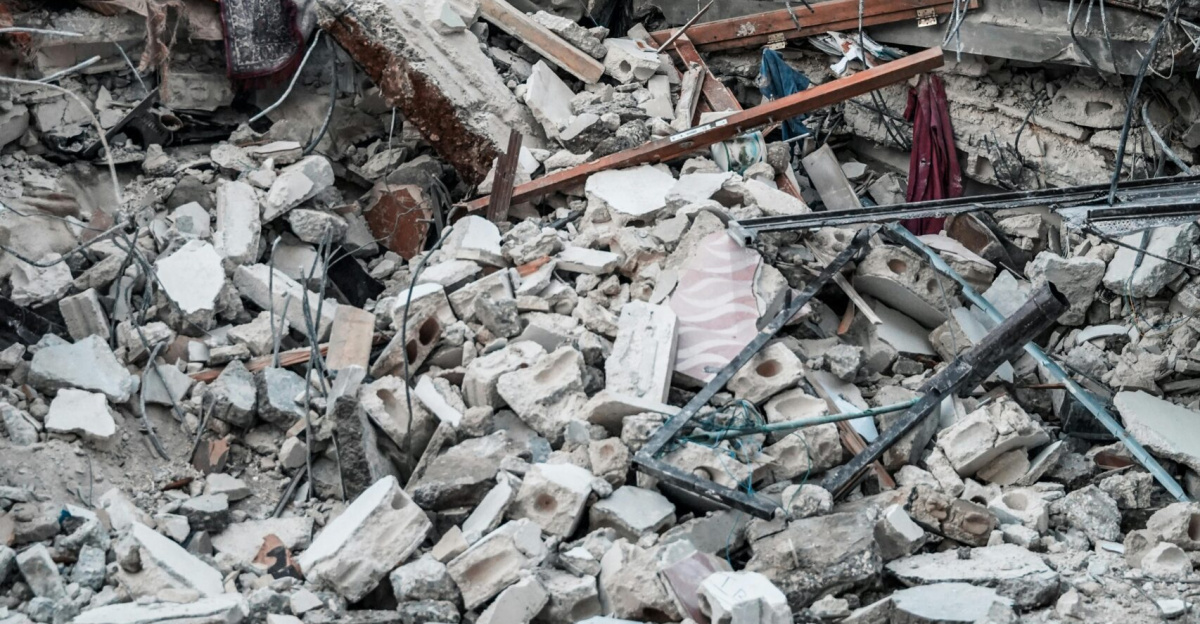 People inspect rubble after an earthquake in Jindires, Aleppo Governorate, Syria.