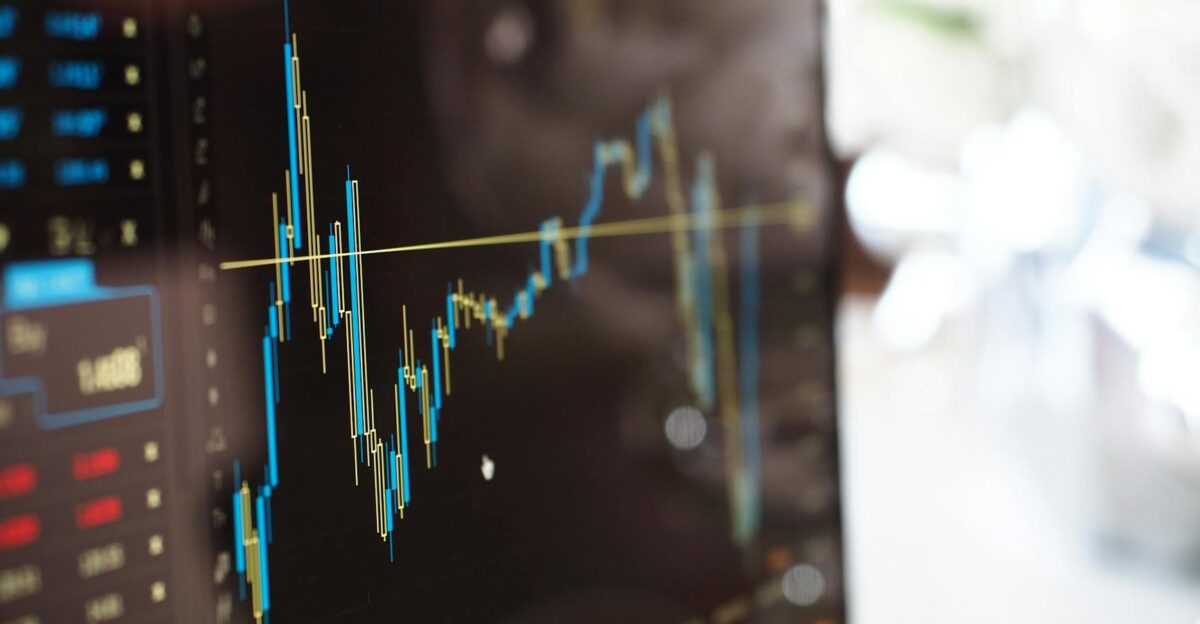 Detailed view of financial trading graphs on a monitor illustrating stock market trends