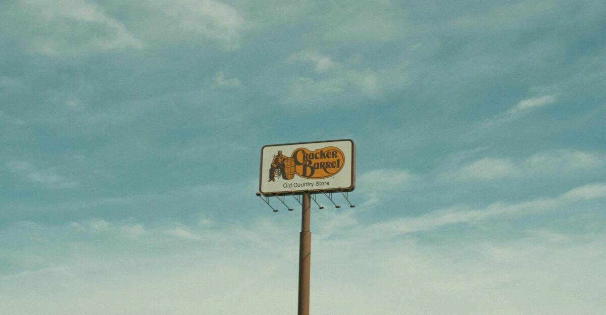 Cracker Barrel signpost with a clear blue sky background in Valdosta GA USA