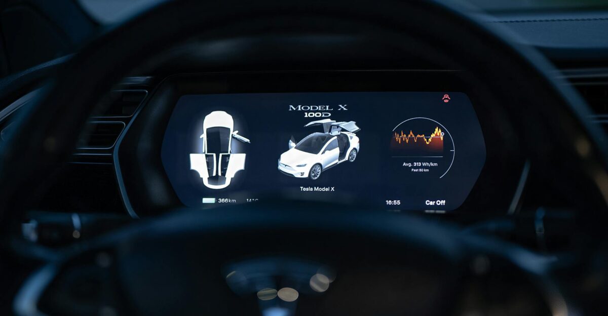 Close-up view of a Tesla Model X dashboard showcasing its digital display and futuristic controls