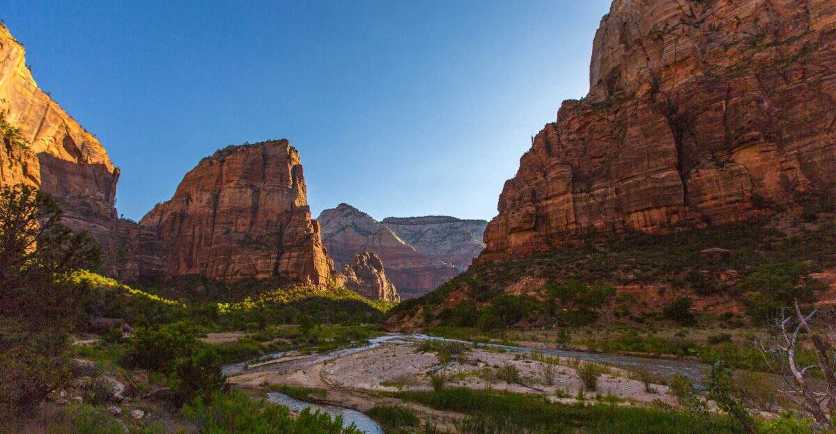 Scenic landscape of Zion National Park with towering canyons and a winding river