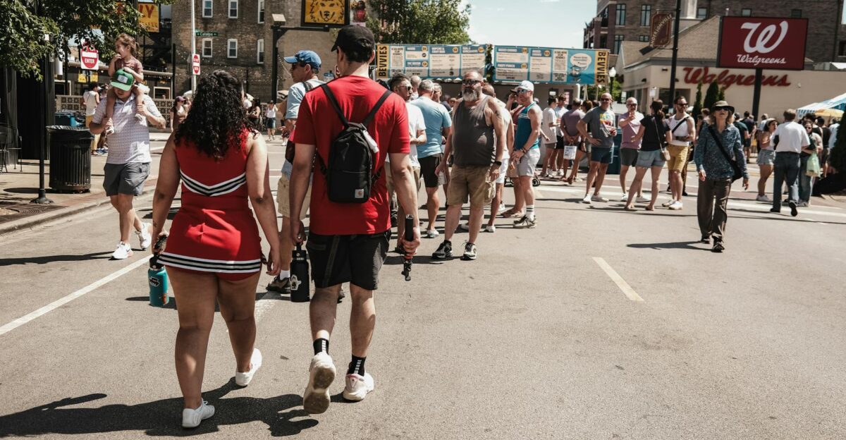 People enjoying a sunlit street event in Chicago IL Capture of urban life with a lively crowd