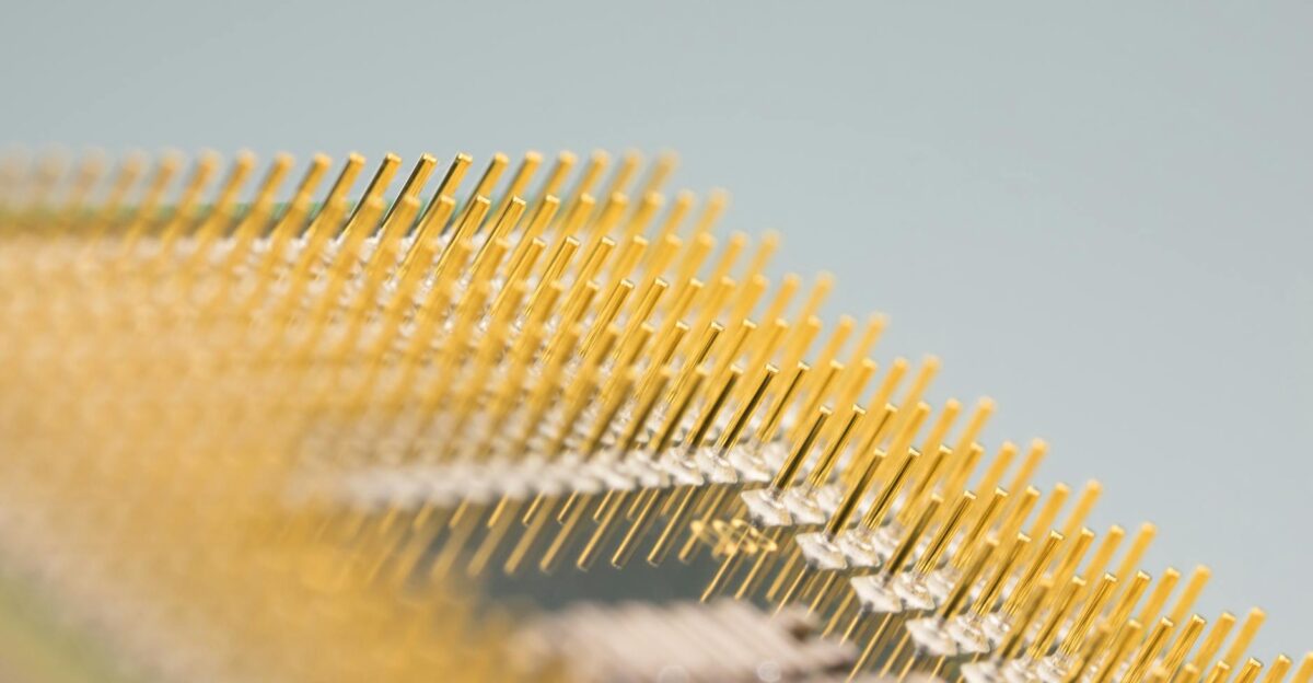 Detailed close-up of gold CPU pins showcasing technology and design on a circuit board