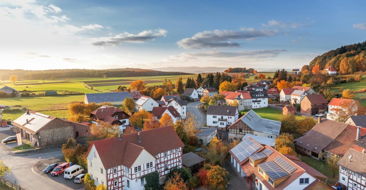 Charming aerial view of a rural village in autumn with vivid colors and clear skies