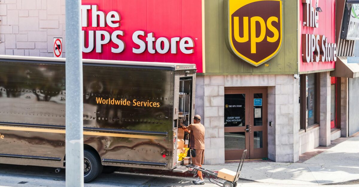 UPS delivery person unloading packages outside a UPS Store in Los Angeles California