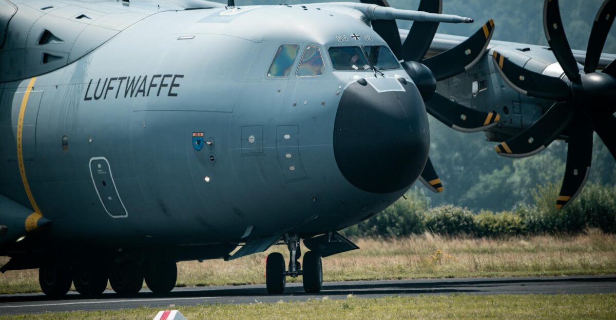 A close-up view of a German Luftwaffe A400M aircraft on the runway ready for take-off