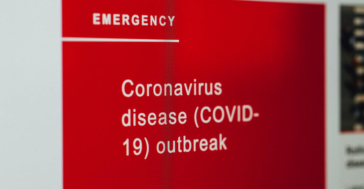 Close-up of a COVID-19 emergency alert message on a digital screen