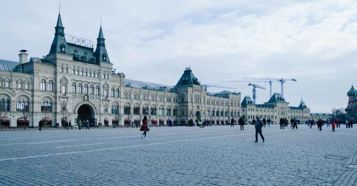 Historic GUM department store facade at Red Square under a cloudy sky Moscow Russia