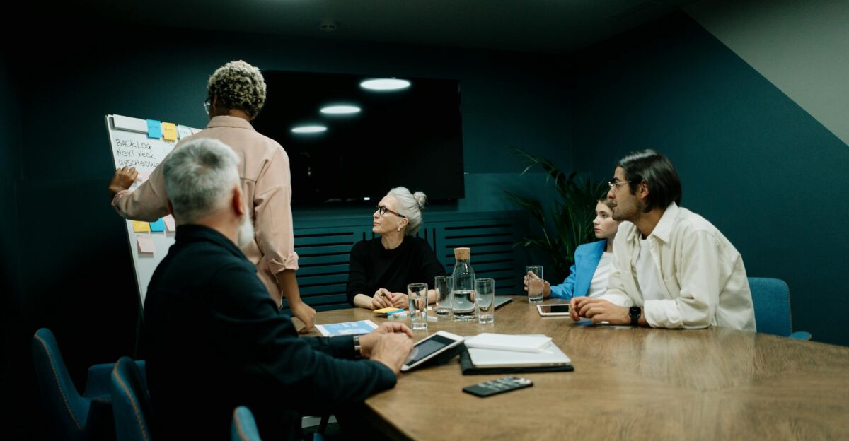 Diverse team discussing business strategy during a meeting in a modern office setting