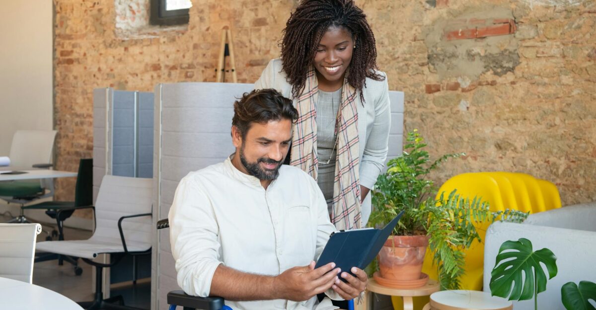 Diverse professionals collaborating in a modern office focusing on technology and teamwork