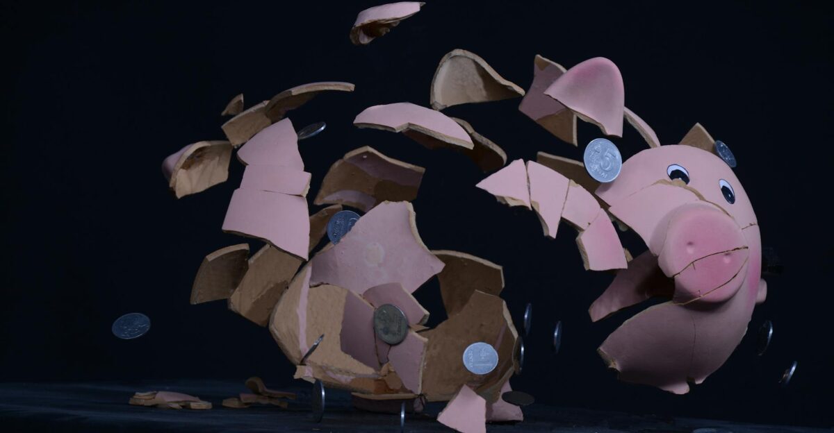 High-speed capture of a piggy bank shattering with coins scattering in mid-air