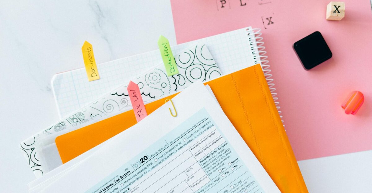 Overhead view of tax documents forms and organized work area for tax preparation