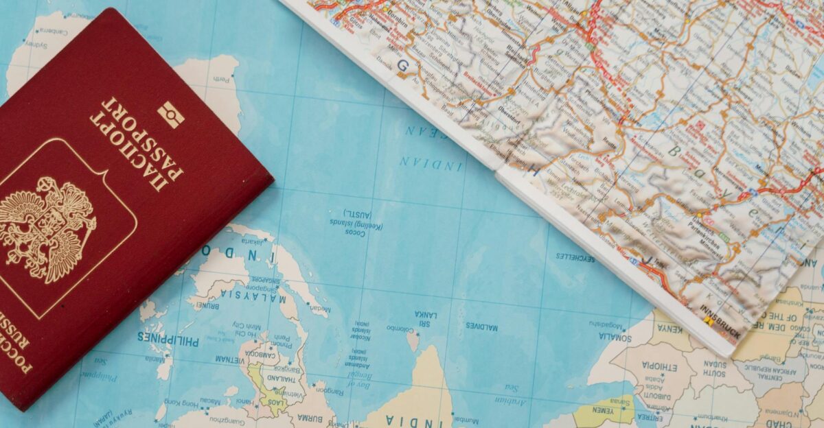 Flat lay of a passport and map symbolizing travel adventure and exploration