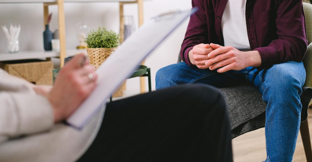 Therapist and client discussing issues in a psychotherapy session highlighting mental health support