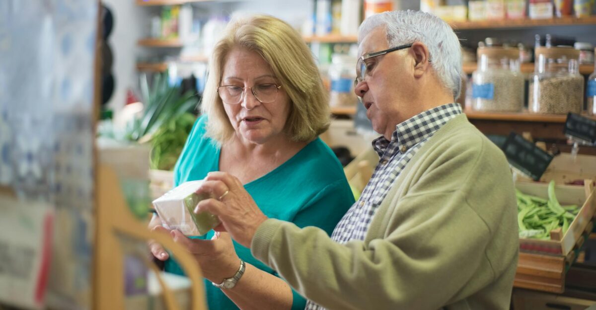 An elderly couple explores products inside a local store in Portugal highlighting everyday life