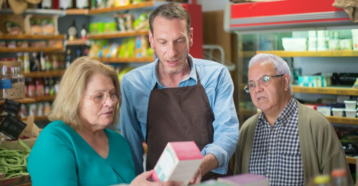A shopkeeper assists elderly customers in a vibrant Portuguese grocery store