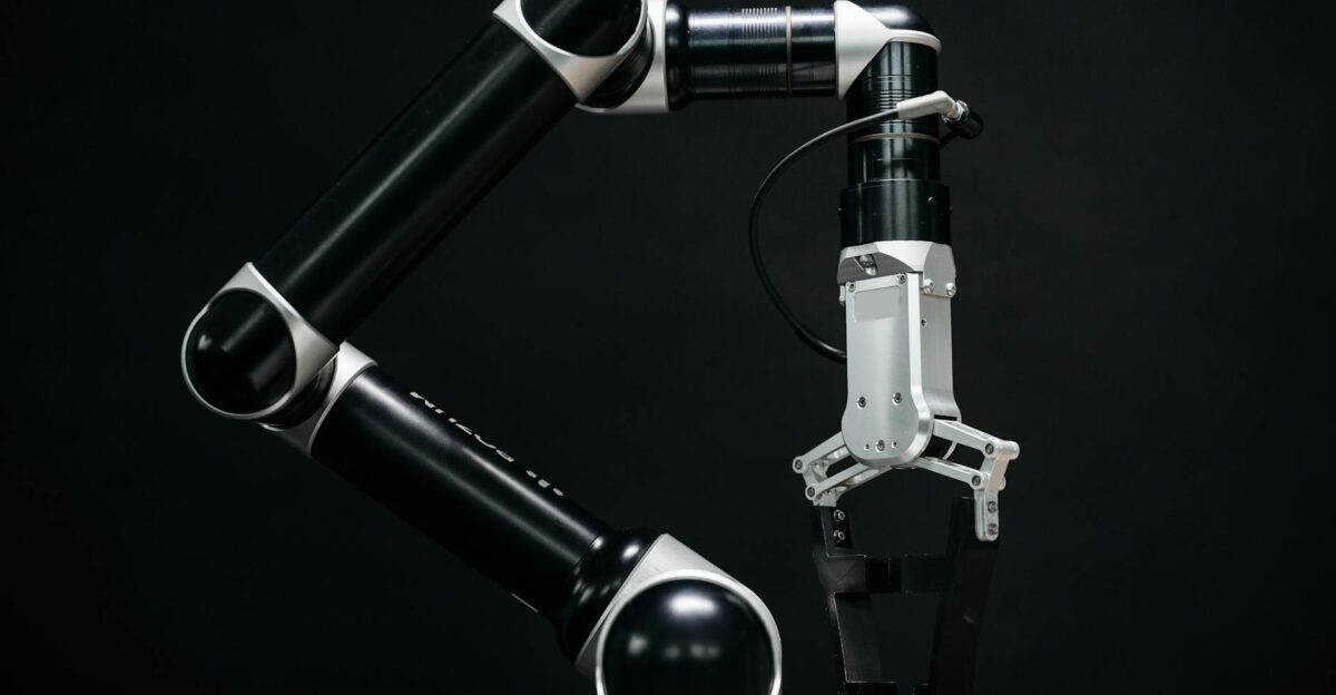 Close-up of a mechanical robotic arm with a dark background showcasing advanced technology