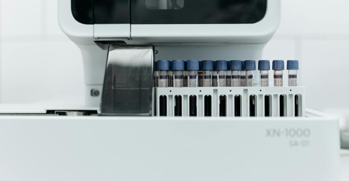 Close-up of laboratory machine holding test tubes for analysis