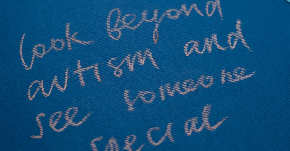 Inspirational autism awareness message with puzzle pieces on blue background.