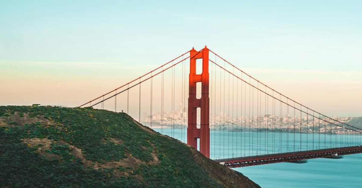 Stunning view of the Golden Gate Bridge during sunset overlooking the ocean and shoreline