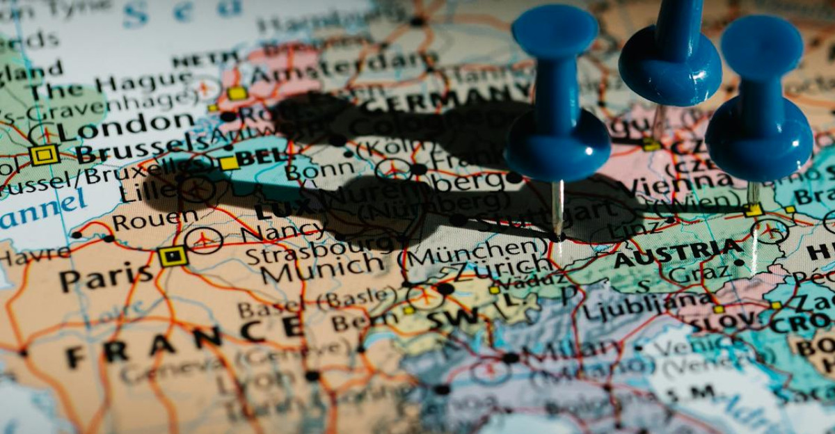 Detailed close-up of a European map with blue pushpins marking important locations