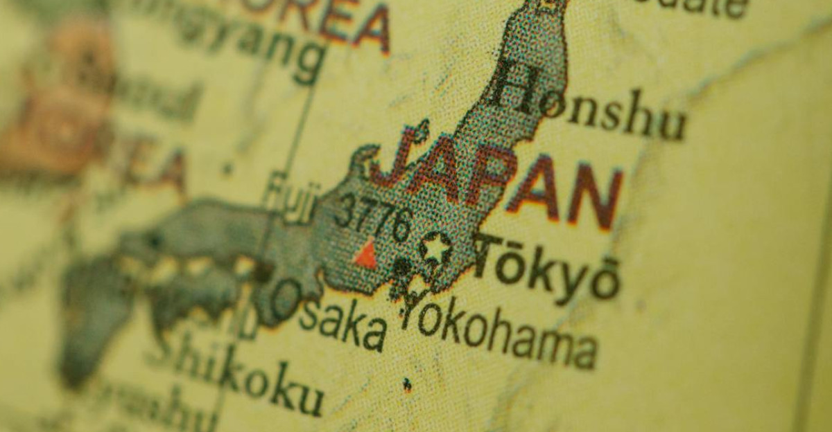 Close-up of a vintage map highlighting Japan and Korea with a selective focus