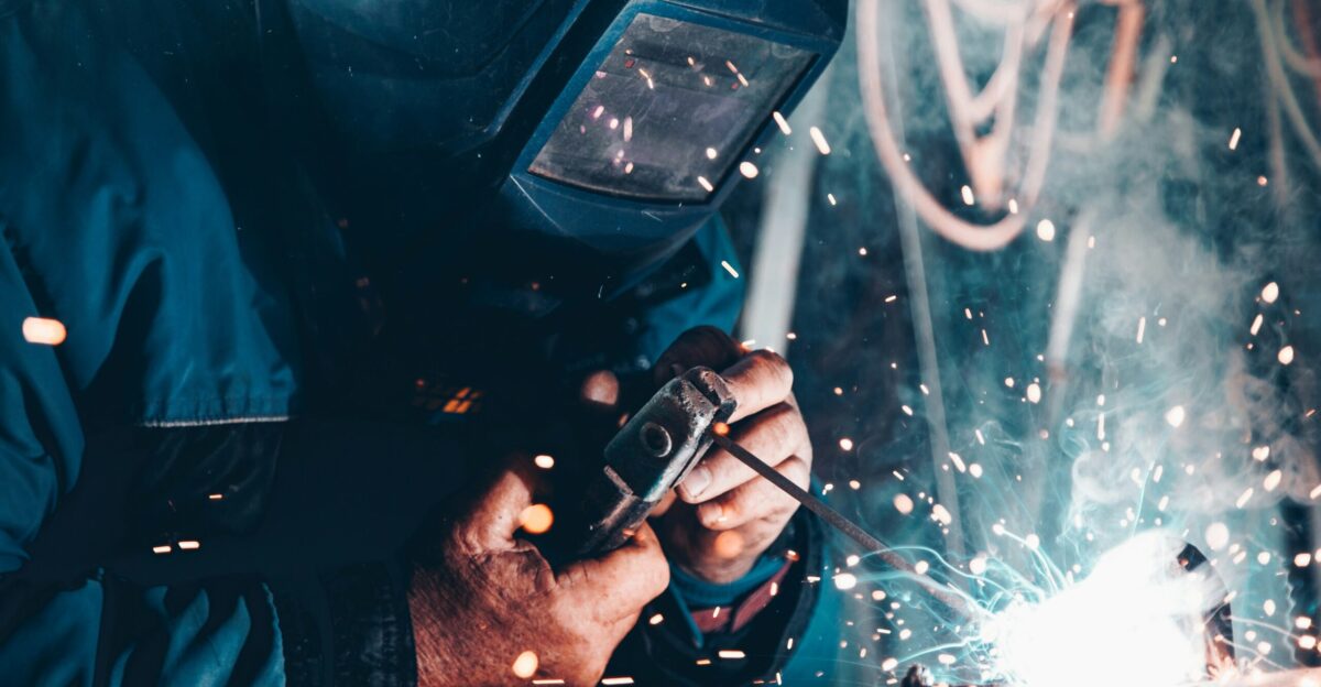 man using welding machine